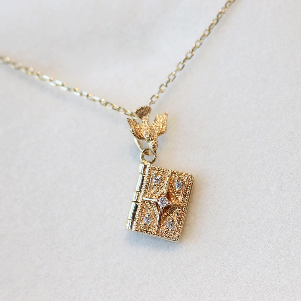 'a book of happiness\' pendant