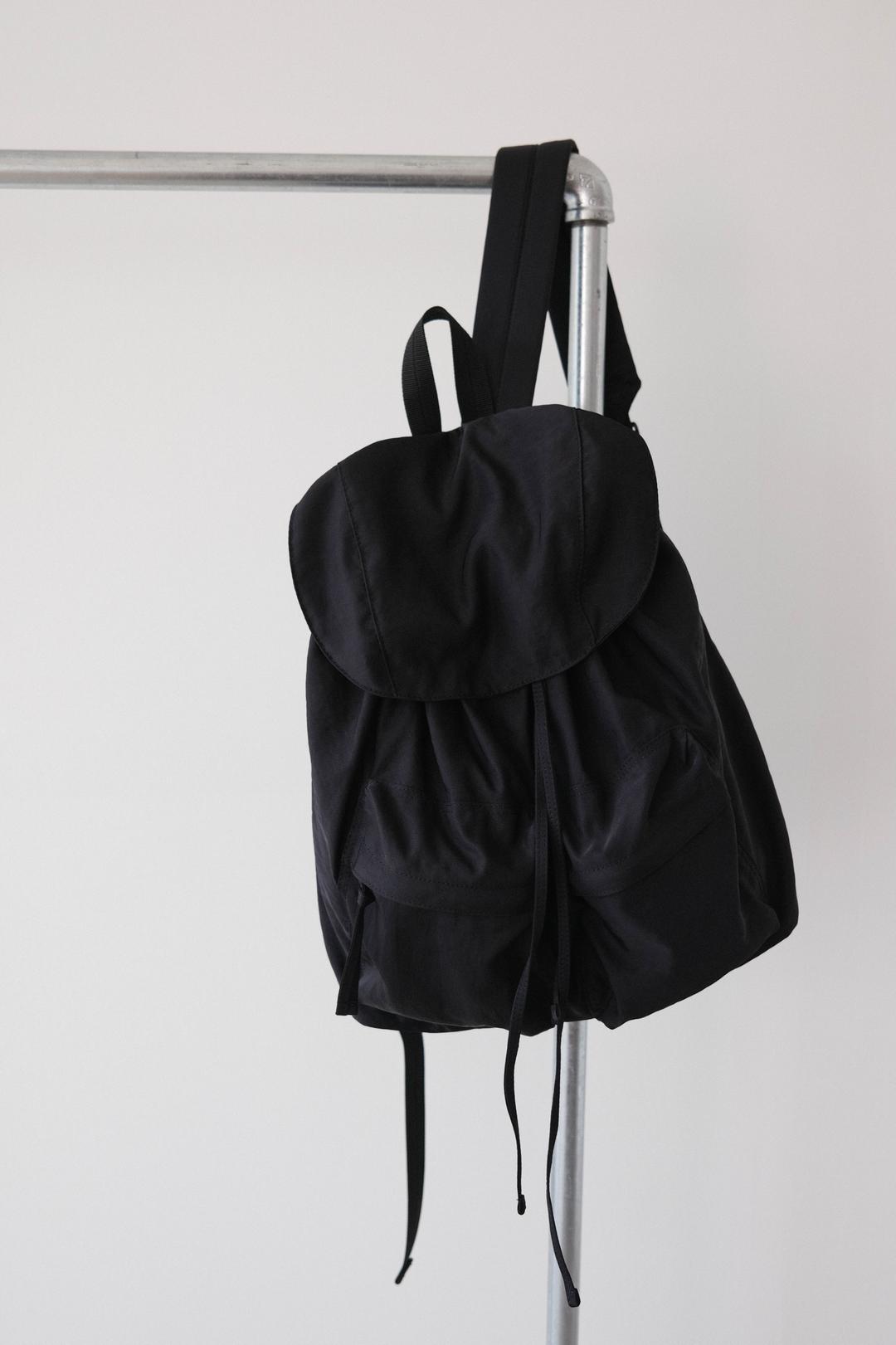 [buttercream x projet] Pocket string backpack , black