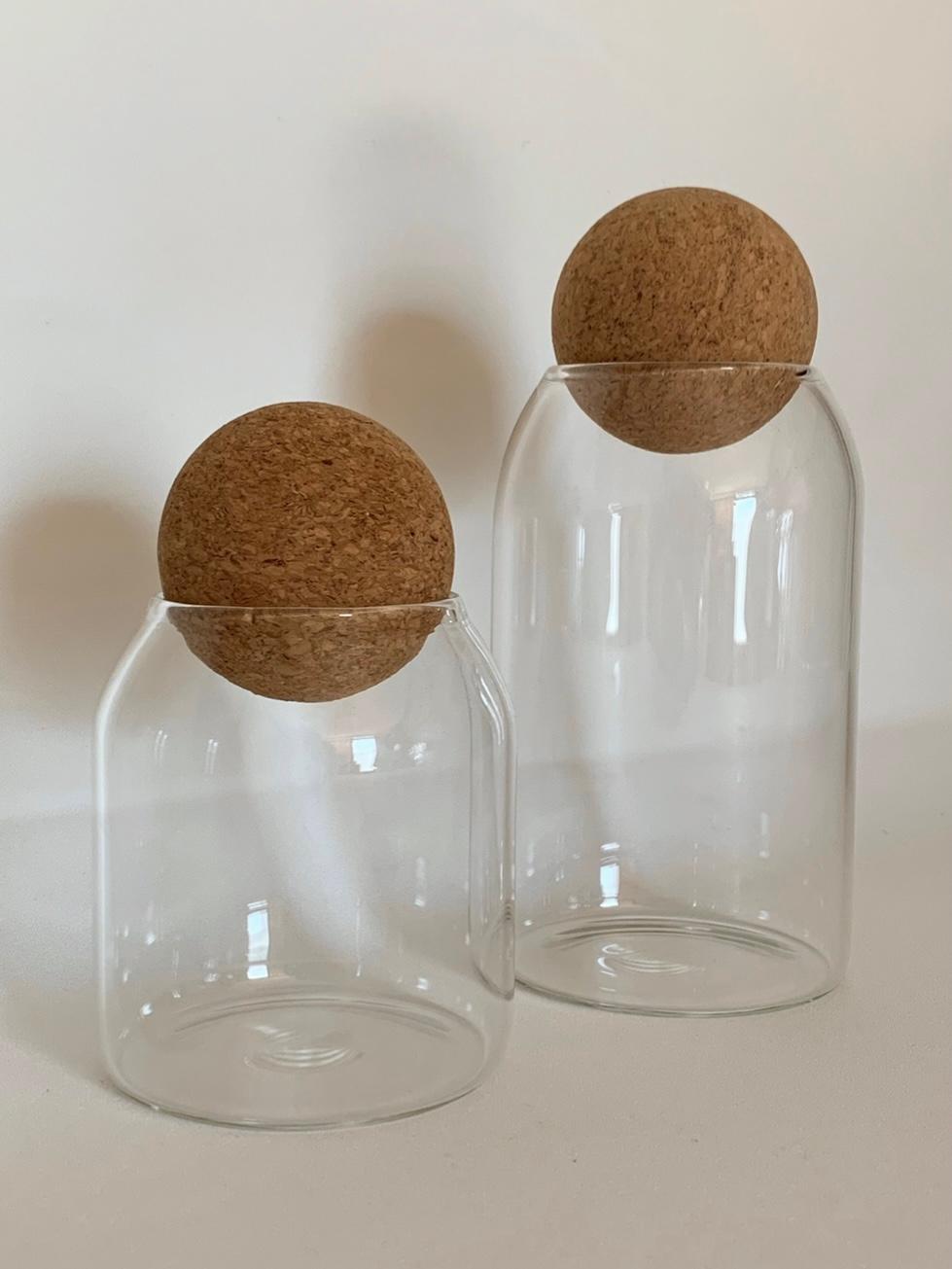 Glass storage container with a ball cork lid