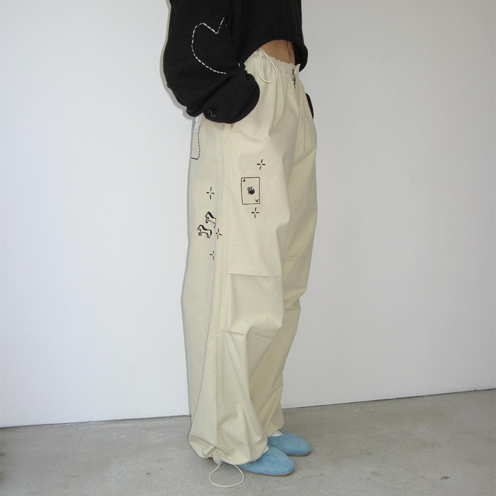 DRAWING STITCH PARACHUTE PANTS BEIGE