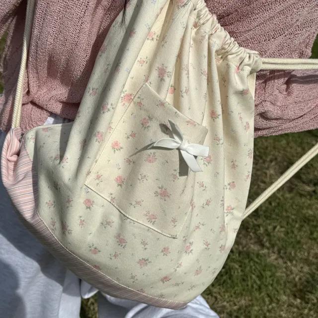 포이 포에 러블리 플라워 리본 포인트 포켓 스트링 백팩(2color)