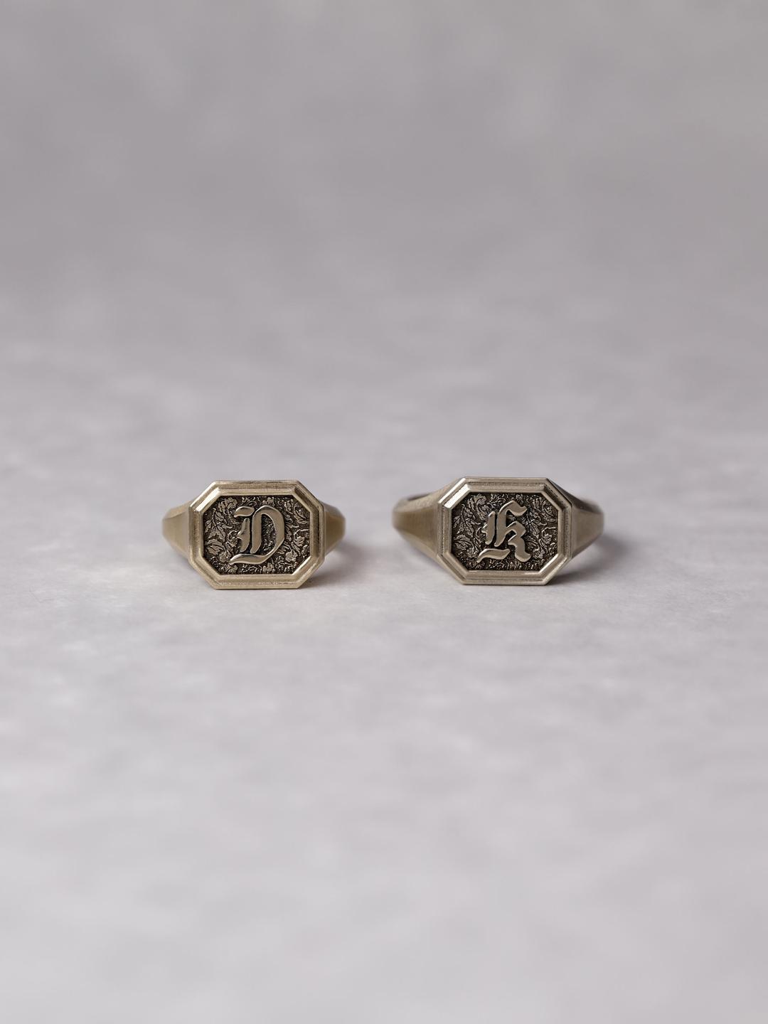 square framed initial signet ring.