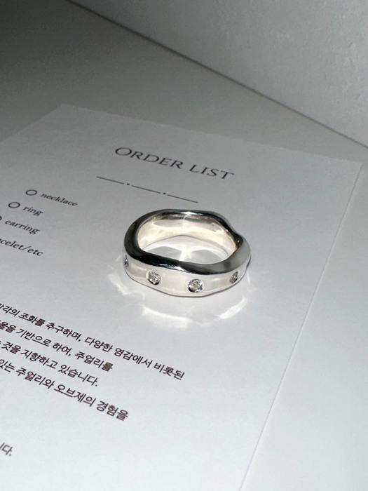 white cubic ring