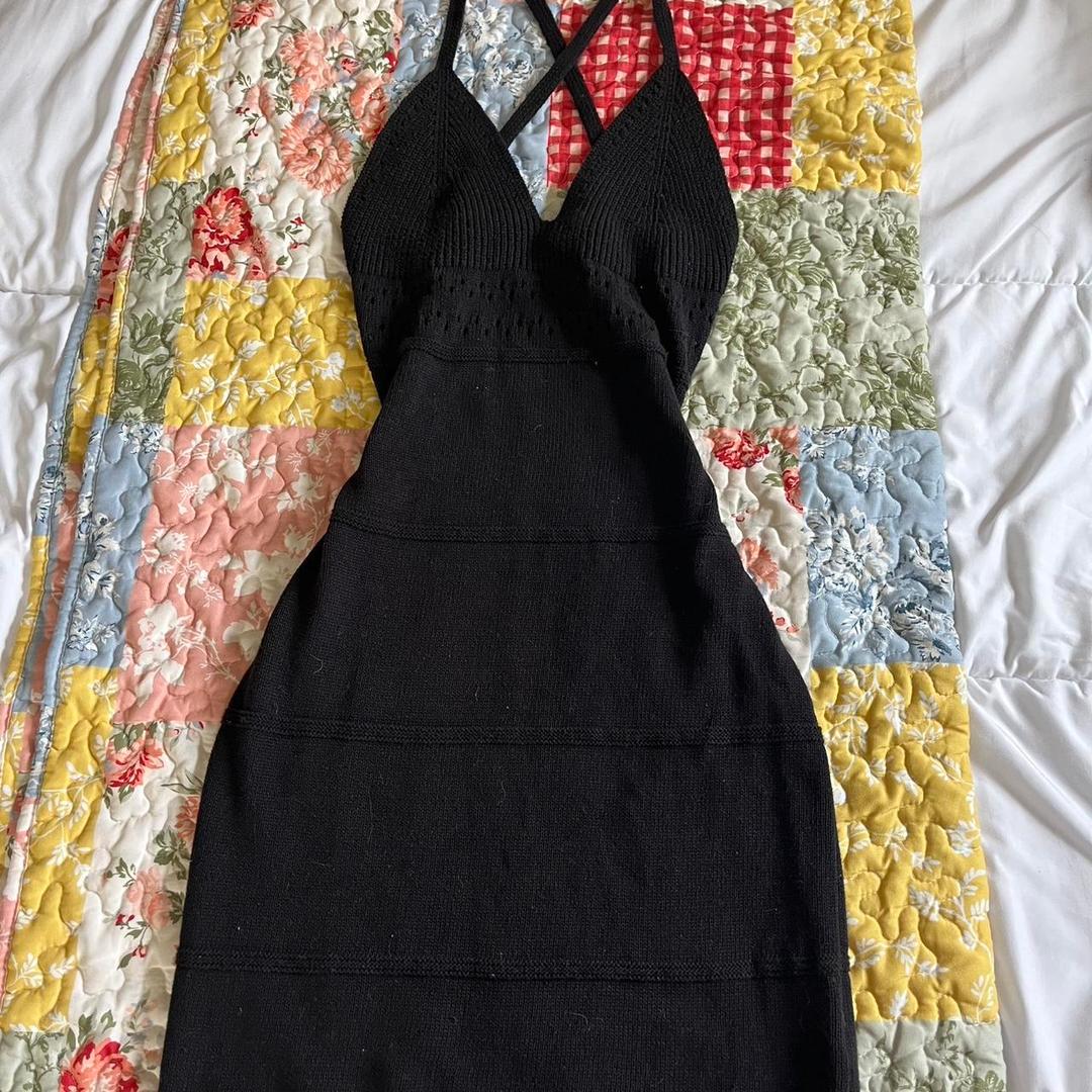 black knit bodycon dress, knee-length with cut outs...