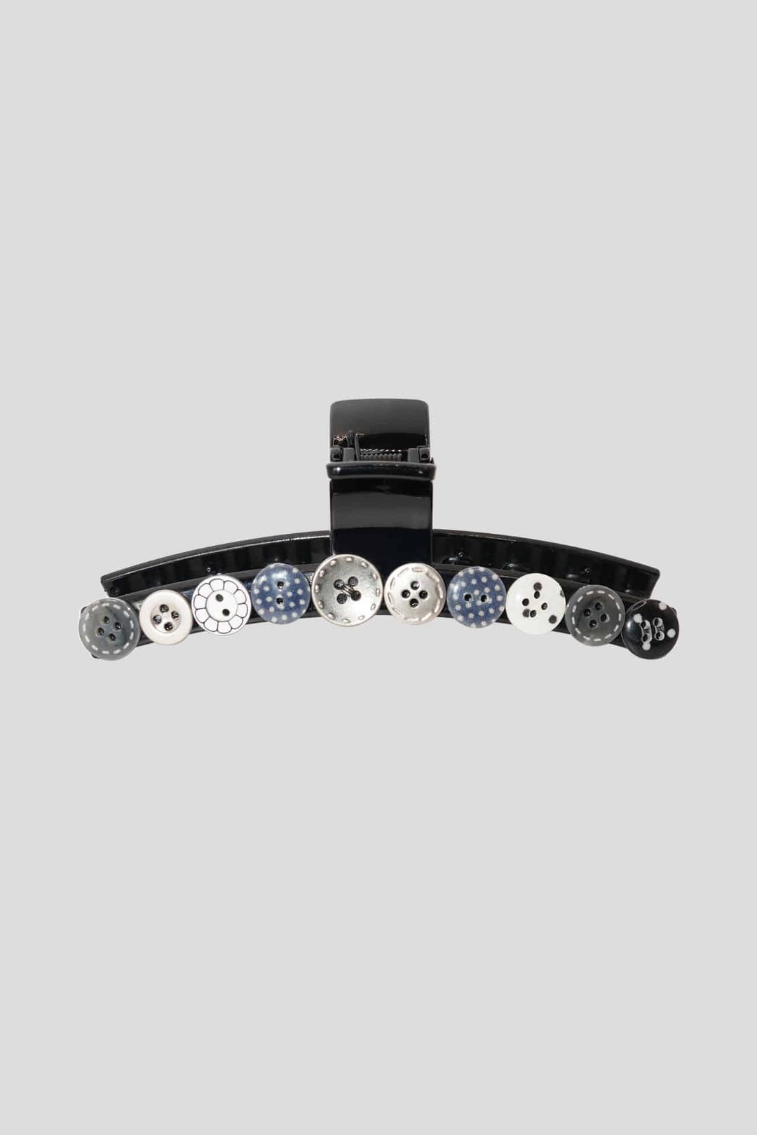 black button hair clip