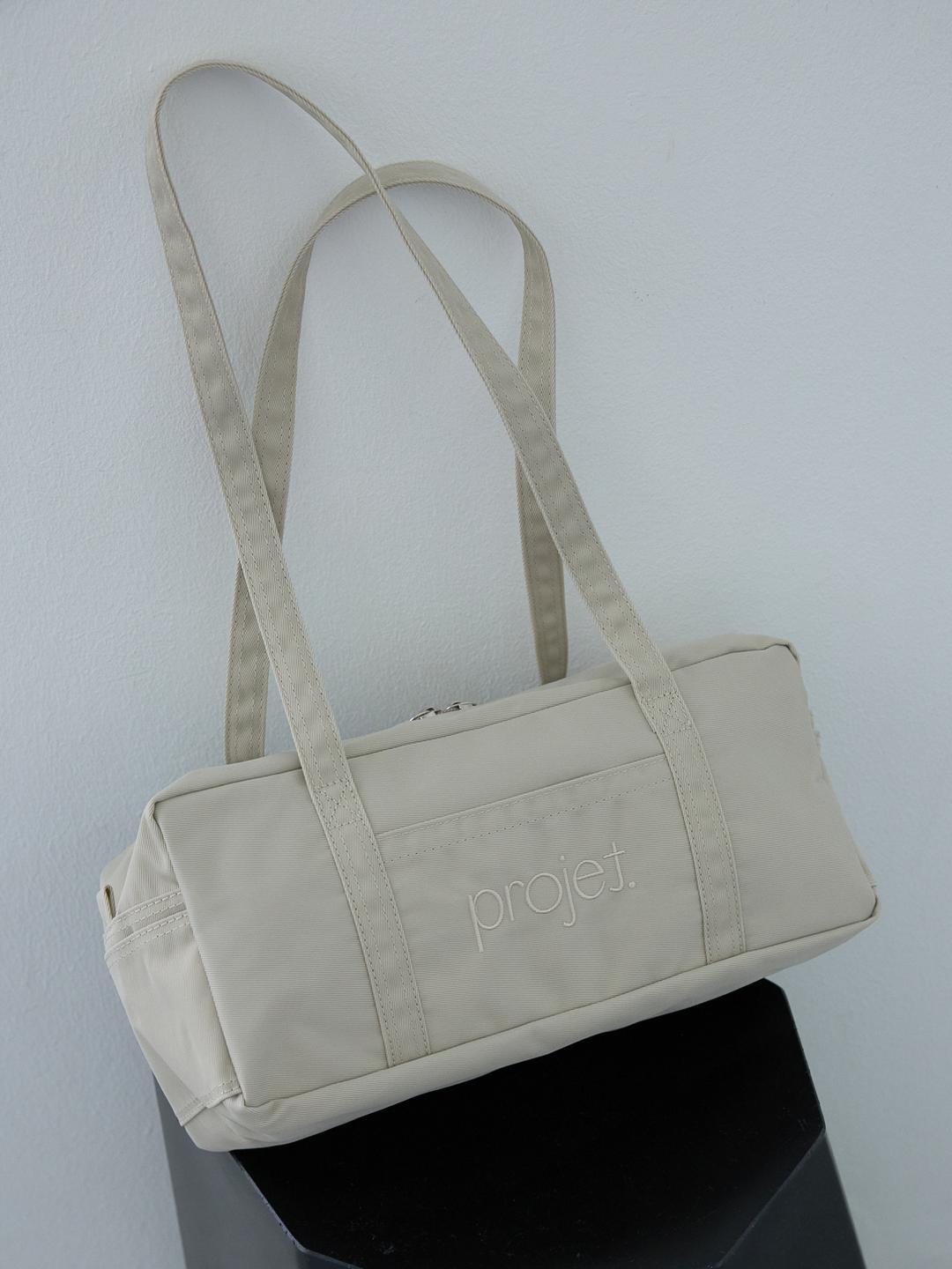 compact duffle bag (light beige)