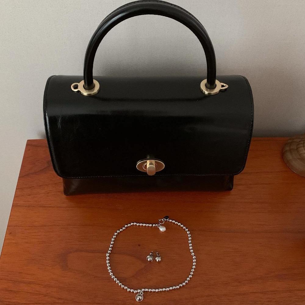 signature top handle bag