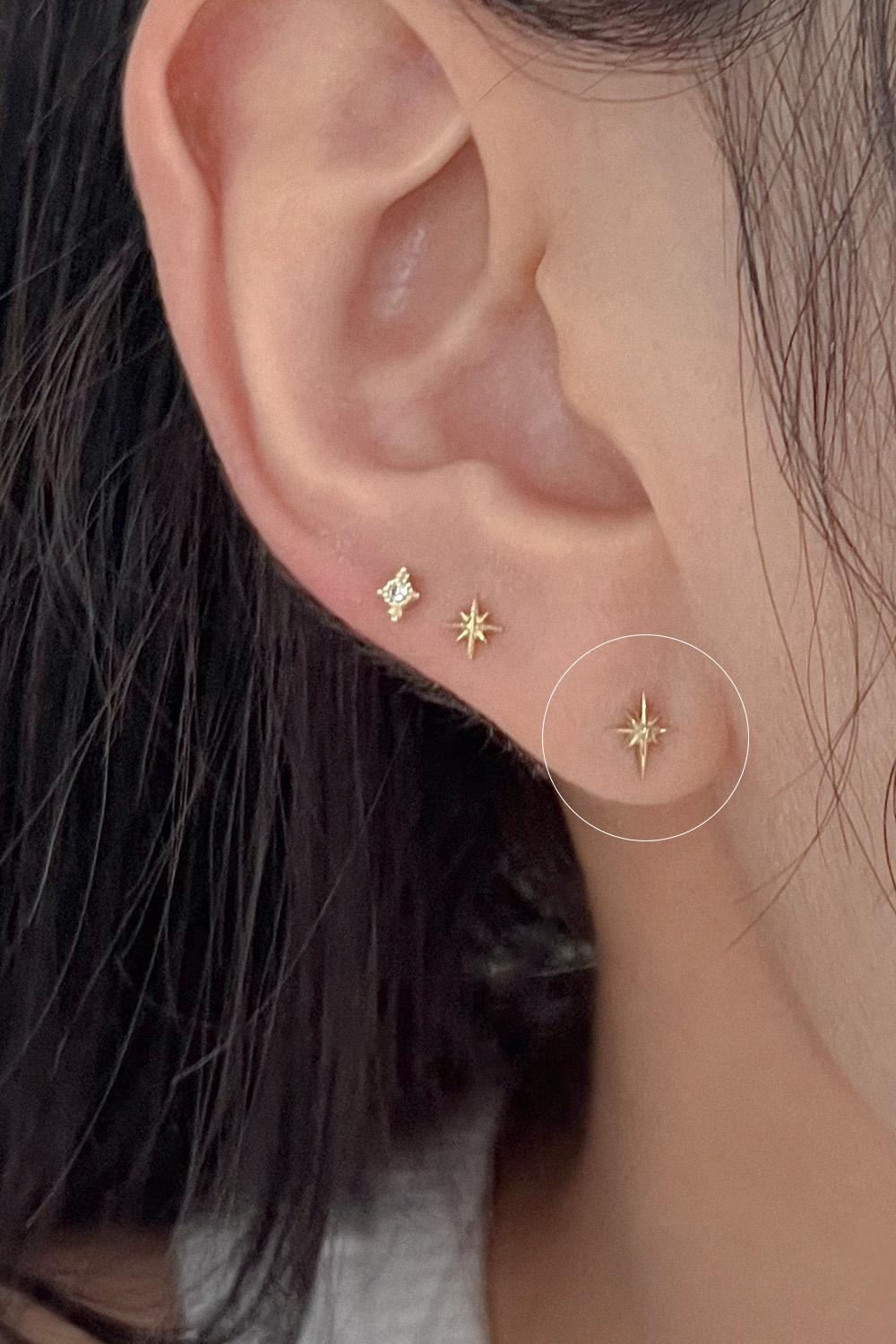 14k cross sparkle piercing