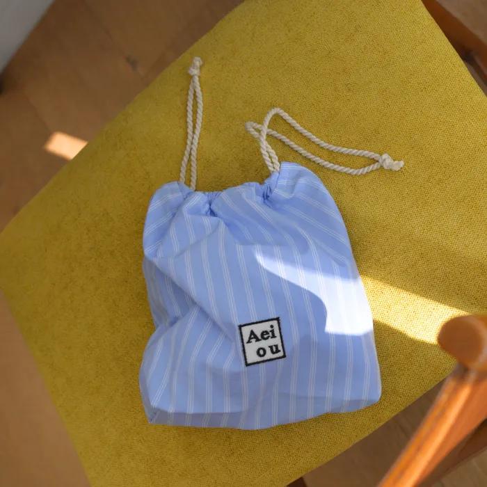 Aeiou String Pouch Good Morning Strip(Beige)