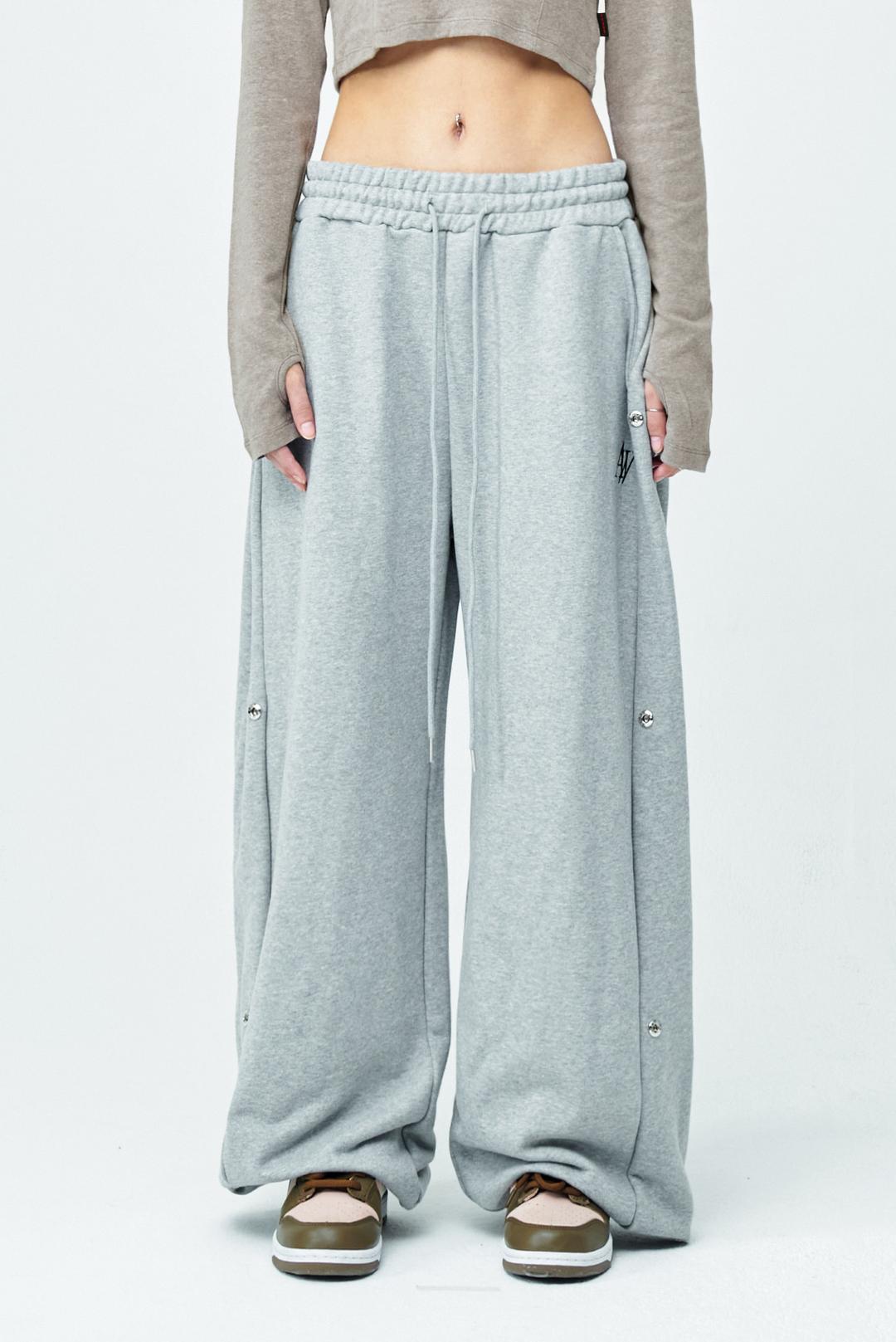 22FW01AW057 AW 로고 사이드 스냅 트레이닝 팬츠 (8%멜란지)