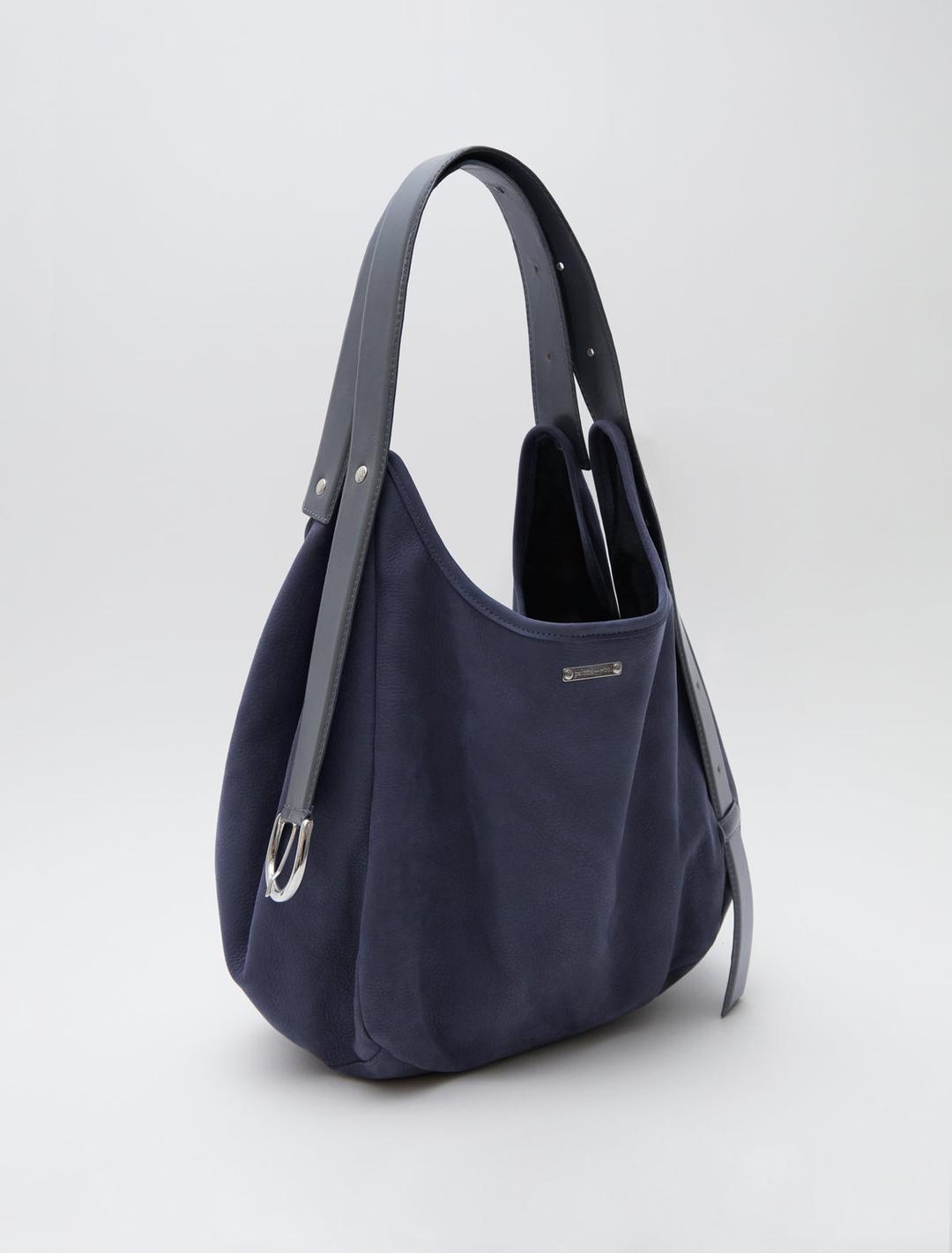 EMILIE BAG-Navy bucket bag featuring a belt-inspired handle design