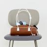 25 Spring_ Brown Piping Baguette Bag