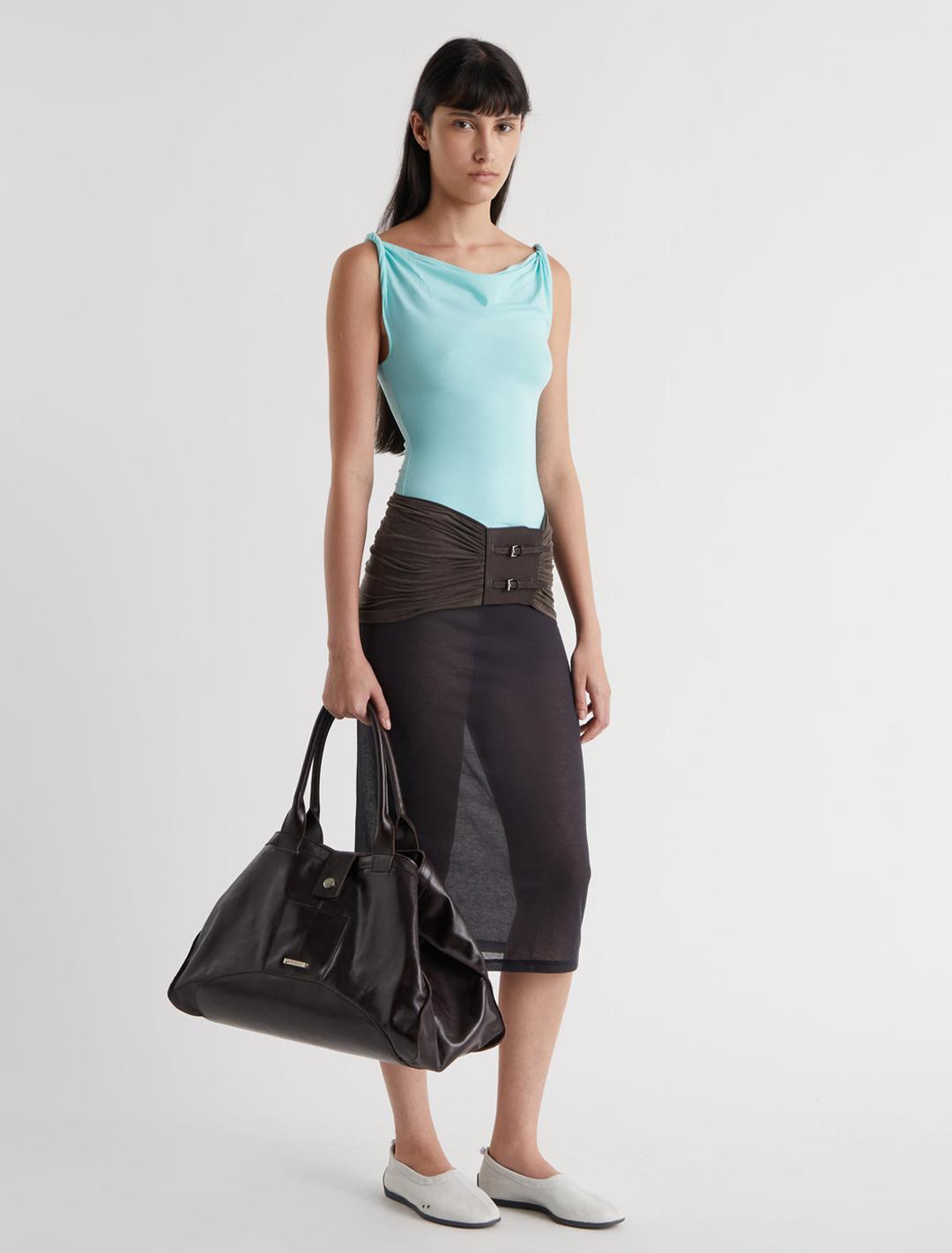 SIMP-Light blue sleeveless top featuring twisted shoulder details