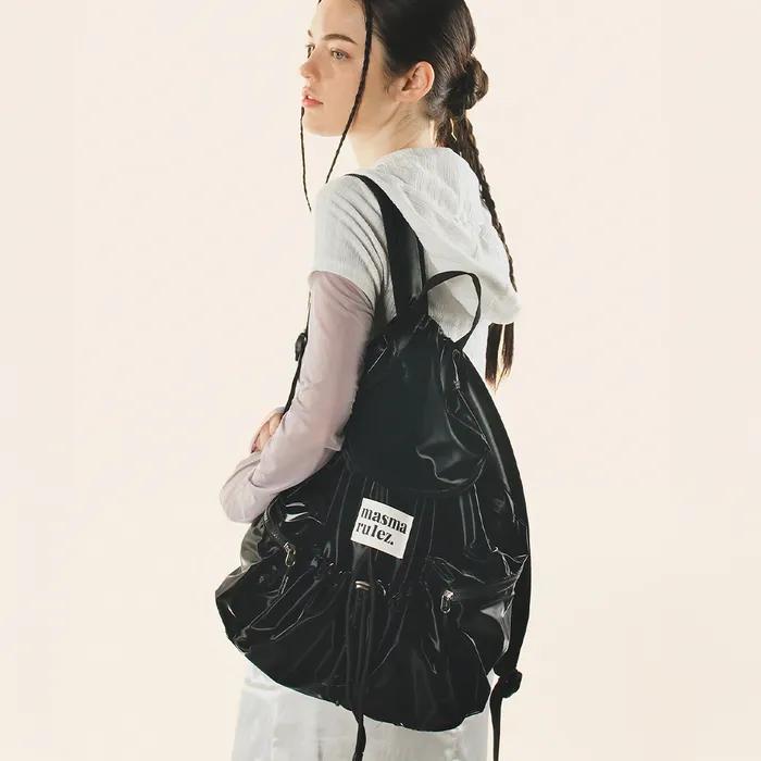 String flap backpack _ Glittery black