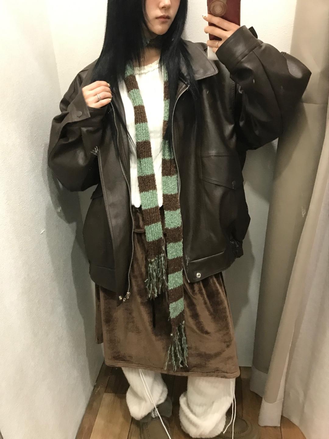 Dumb-bell over leather jacket