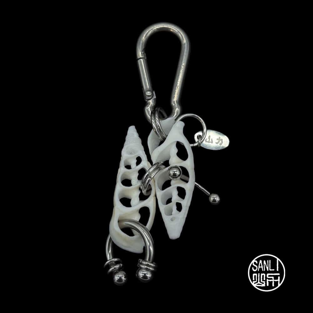 shell piercing keyring