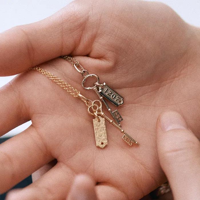 cle de chance + number tag pendant set.