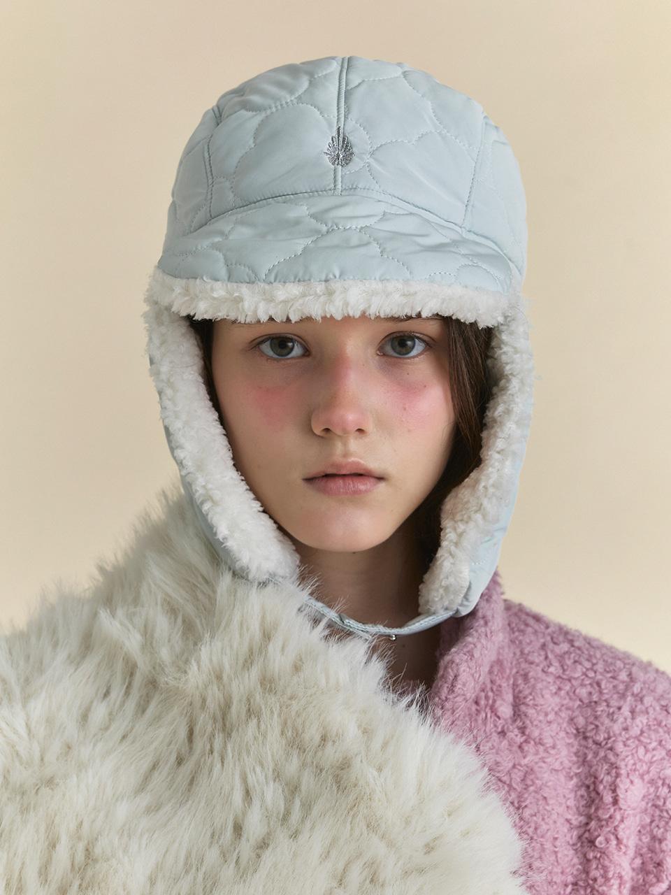 PADDING EARFLAP HAT IN CLOVER ICEBERG