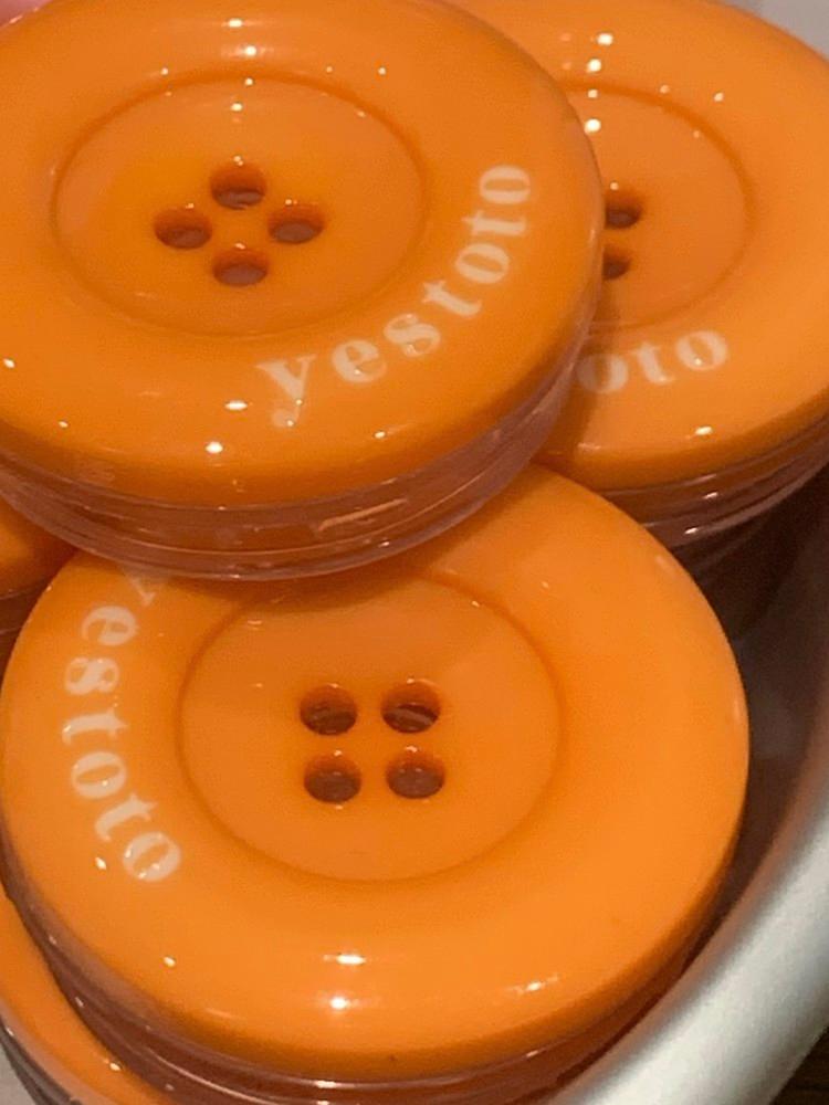 628 tangerine buttontok