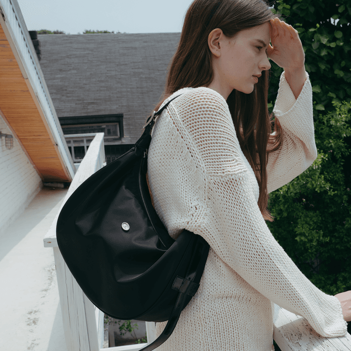 Classic button half moon nylon bag Black