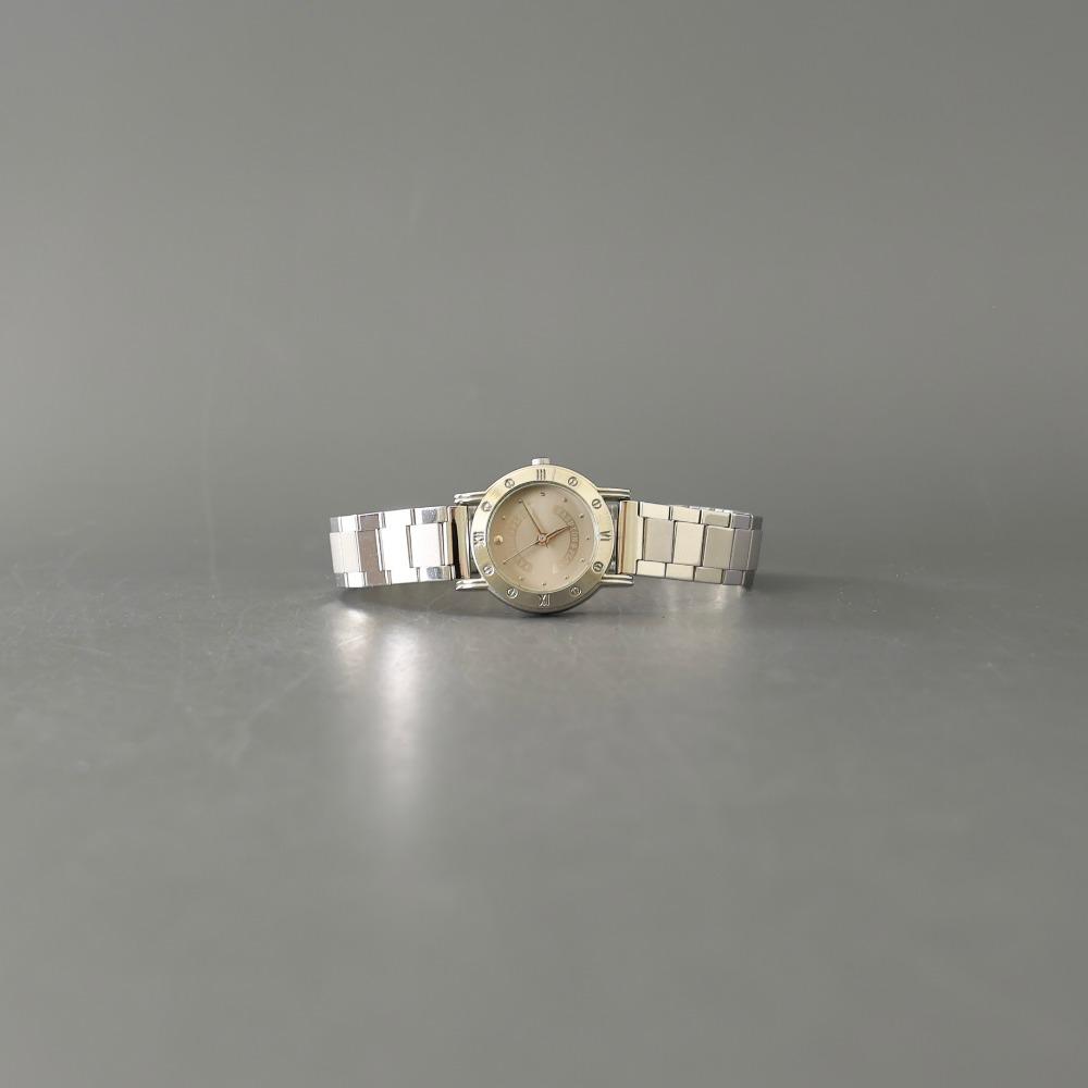 Gray silver round metal watch