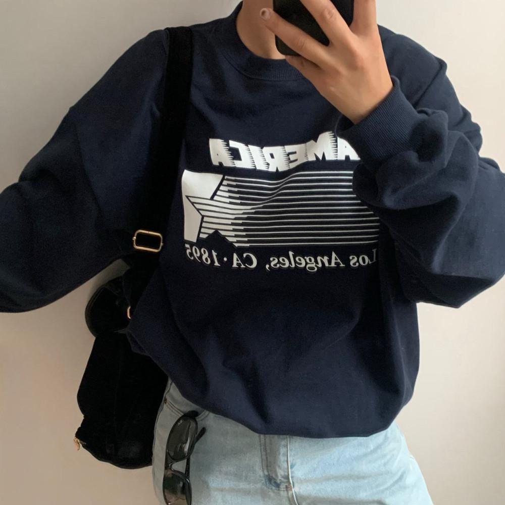 아미먼트 아메리카 맨투맨 코튼 쭈리 레터링 나염 라운드 긴팔 오버핏 티셔츠 2col