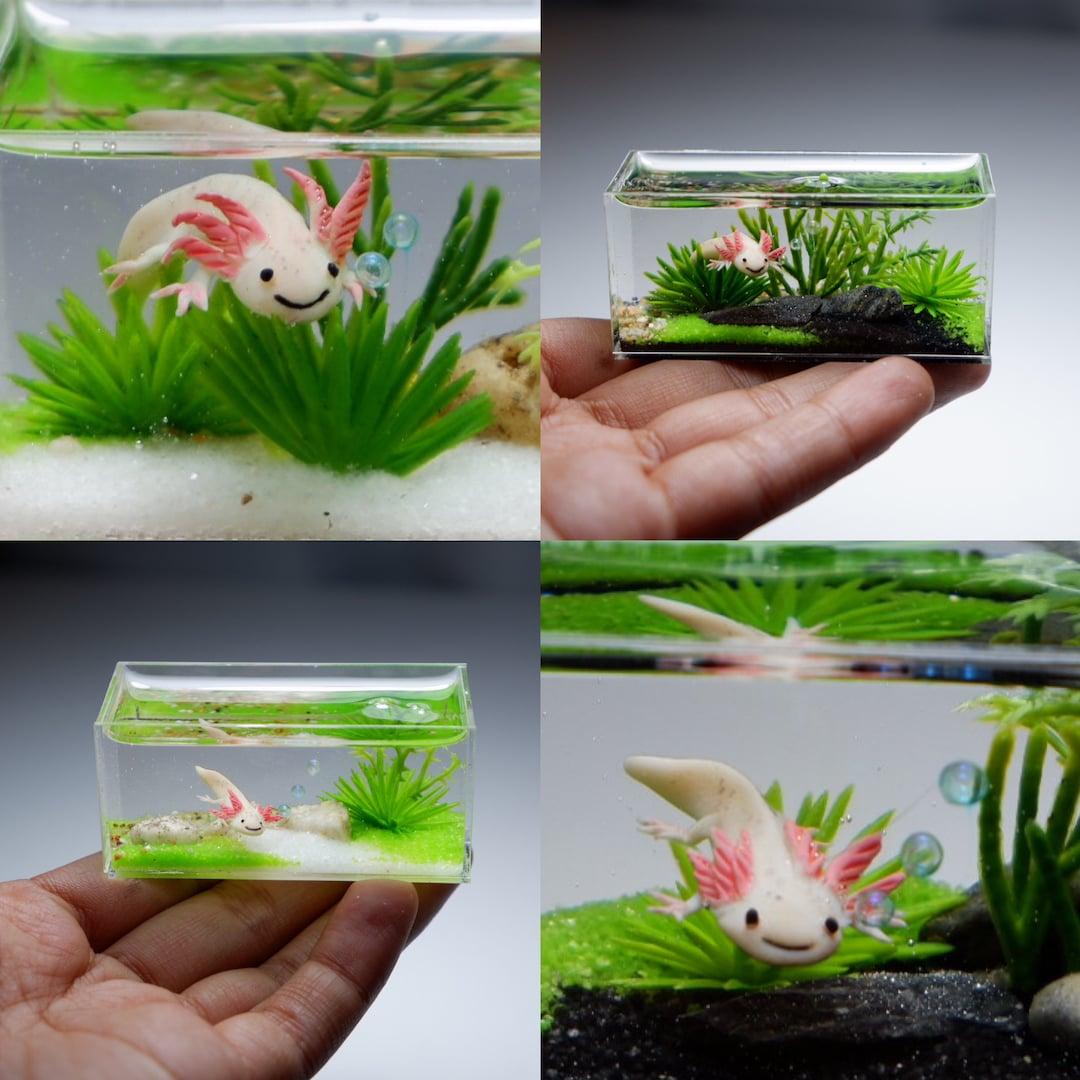 Miniature clay axolotl smiling in the tank