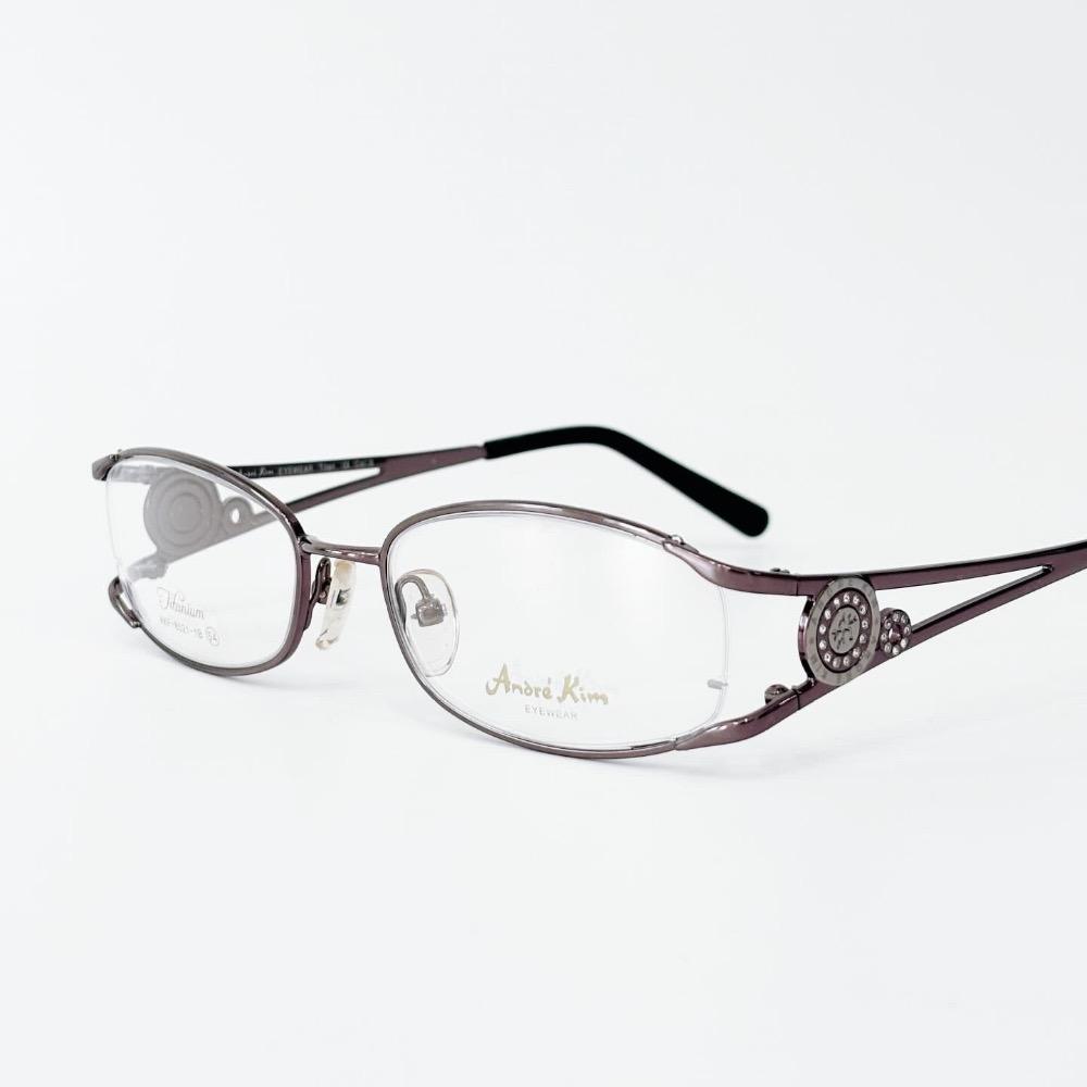 Andre Kim ring logo glasses