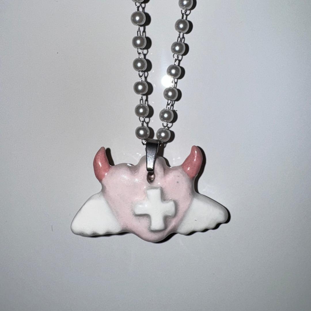 Pink devil heart necklace