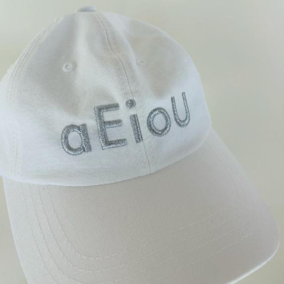 aEioU Logo CapMilk Glass and Silver