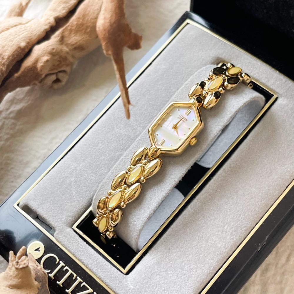 Citizen’s yellow point gold tone watch
