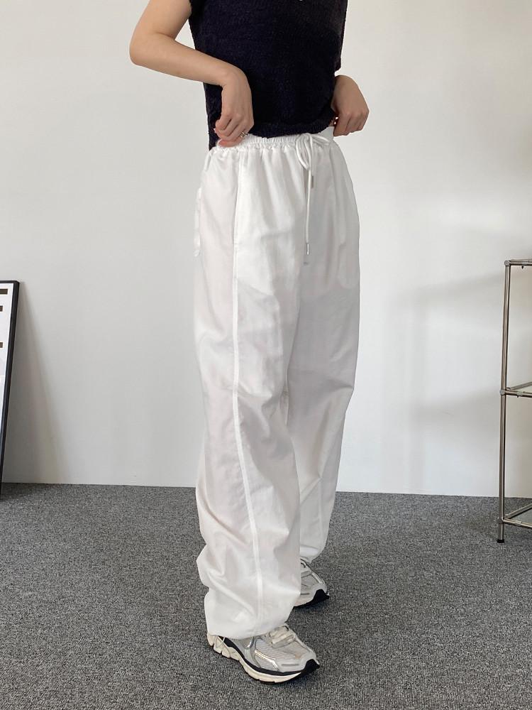 아쿠 와이드핏 나일론 투웨이 밴딩 팬츠