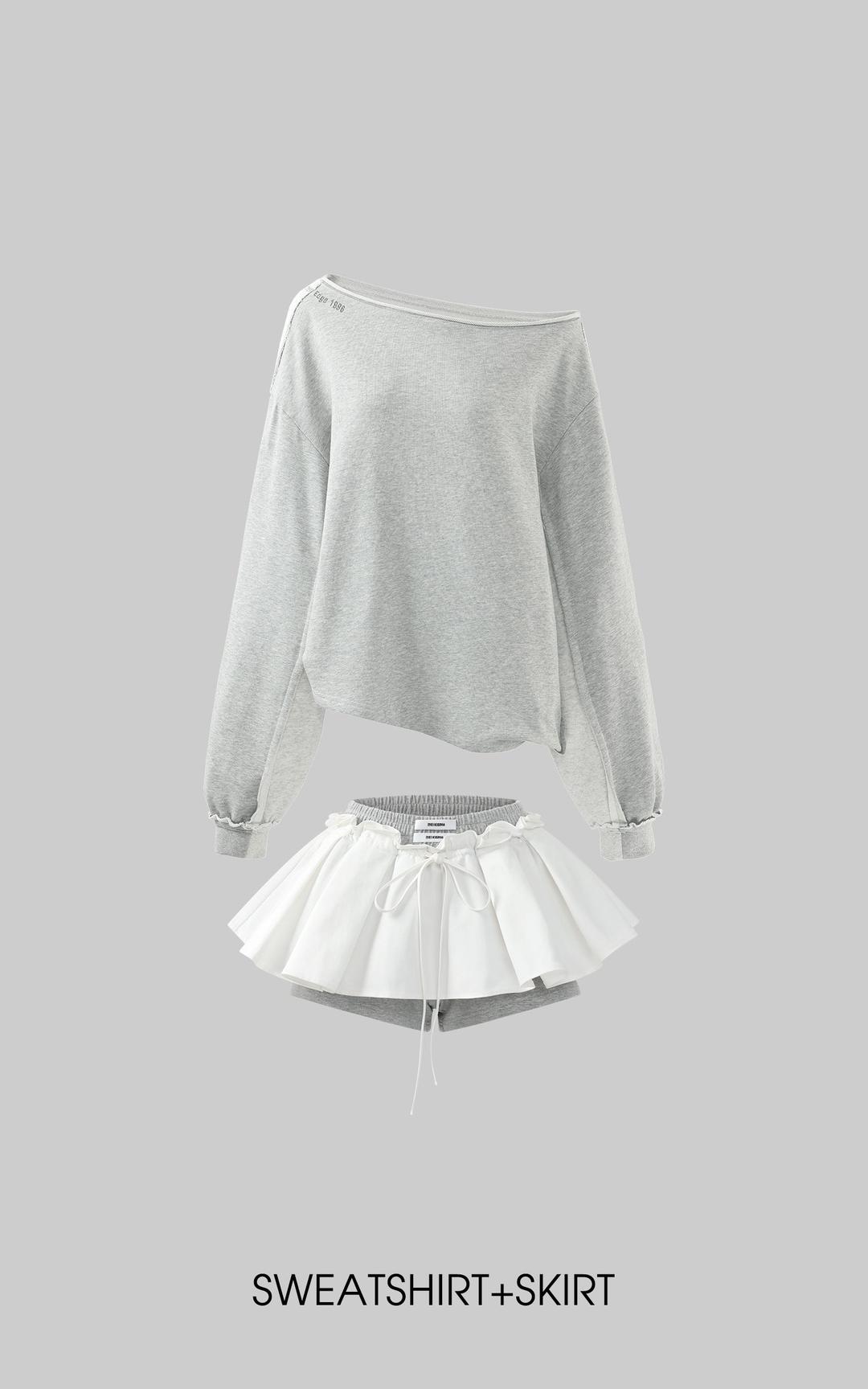 <tc>WARDEN EDGE</tc> 대비 스트링 허리 레이어드 미니 스커트와 스포티 코튼 쇼츠