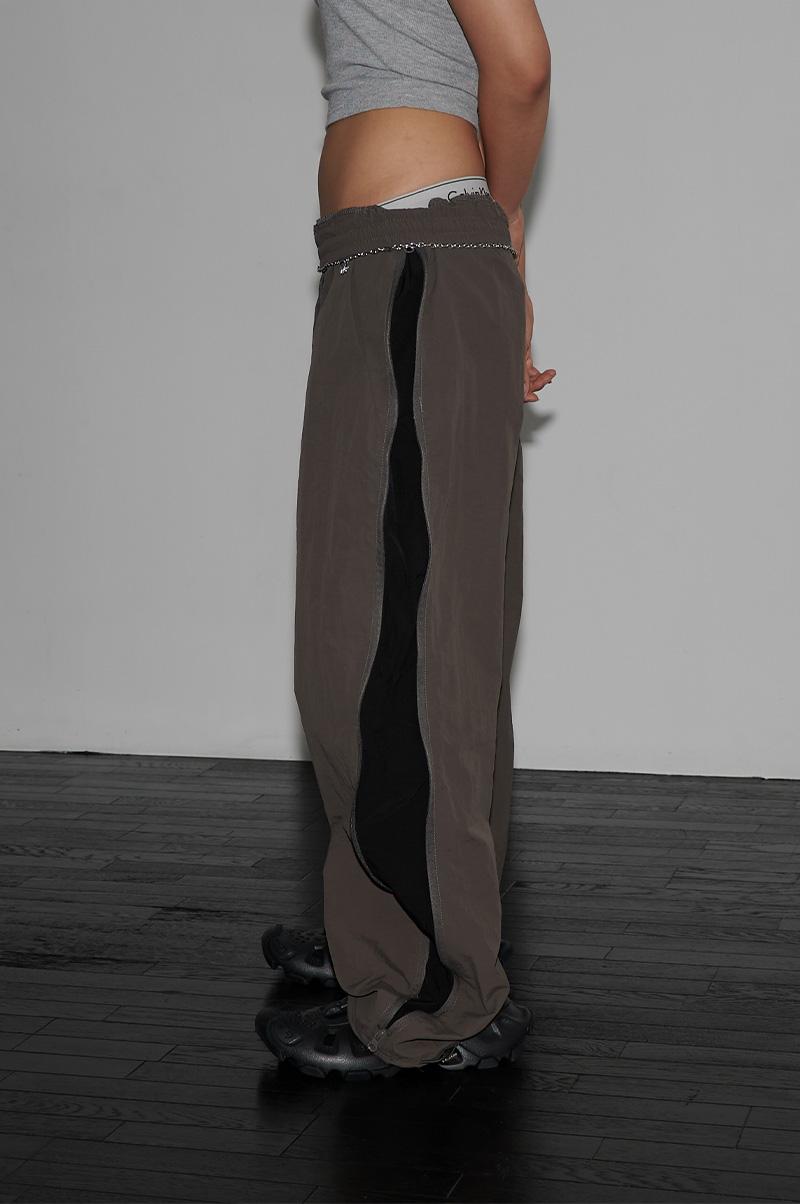 HIGHER CURVED TRACK PANTS - 런츠