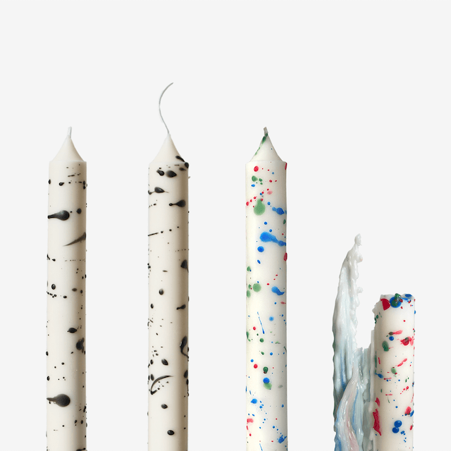 Dripping taper candle