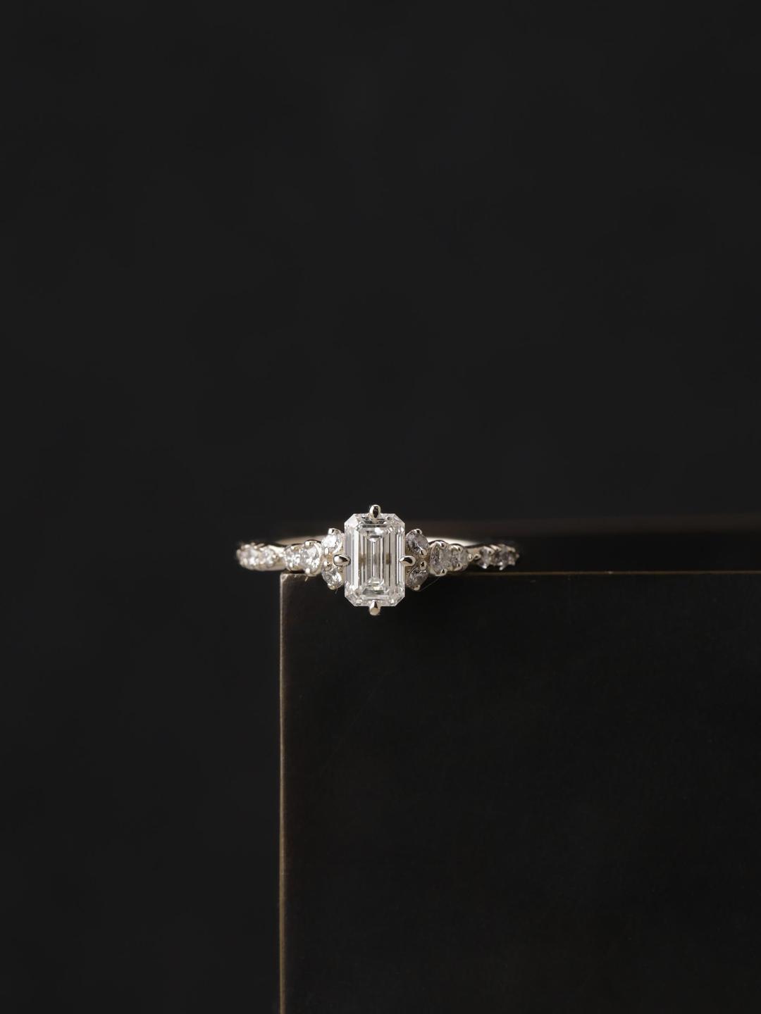 diamond bud cluster ring: GIA emerald cut 0.5ct.