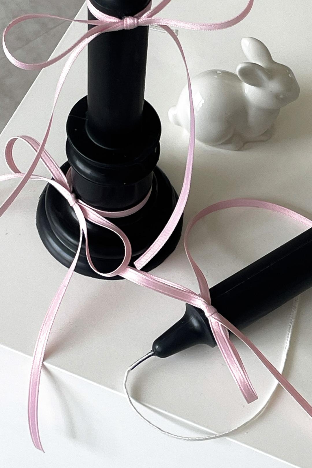 Ribboned taper candle