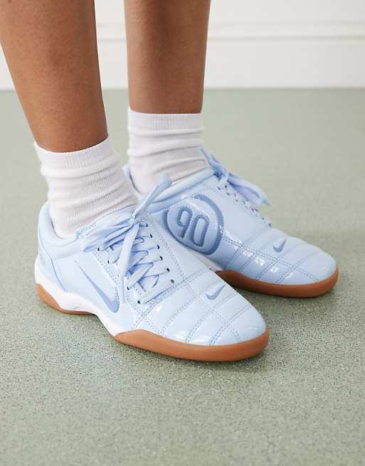 Nike T90 Patent trainers in light blue